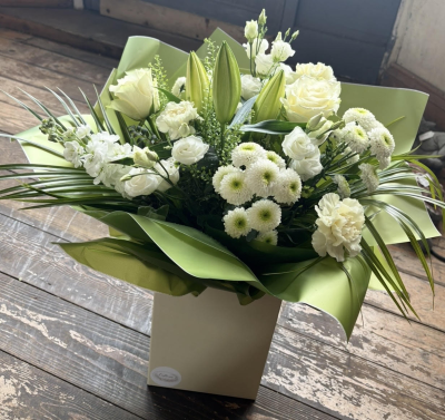 Classic White & Green - A beautifully elegant bouquet featuring crisp white tones, fresh green accents, and lush seasonal foliage.

Flowers subject to availability.