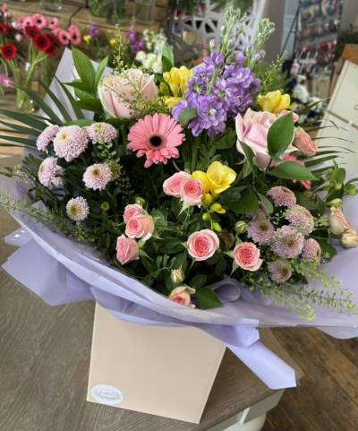 Summer Radiance - A beautifully feminine bouquet featuring a harmonious blend of soft pastel tones, cheerful accents, and lush seasonal greenery. Expertly arranged to create a fresh and elegant display, this charming design combines delicate textures and graceful styling for a gift that feels both luxurious and heartfelt.

Presented in stylish wrapping and a coordinating gift box, the Sophia Bouquet is perfect for birthdays, anniversaries, thank-you gifts, new baby celebrations, or simply brightening someone's day with a thoughtful gesture.