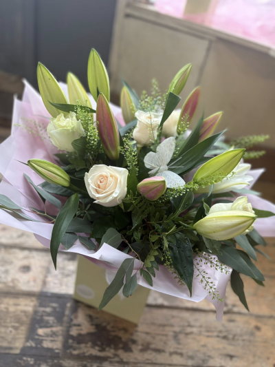 Lily Rose - A graceful and elegant hand-tied bouquet featuring soft blush tones, creamy whites, and fresh greenery, beautifully arranged to create a sophisticated and timeless display. Finished with a delicate butterfly embellishment, this charming design symbolises love, joy, and new beginnings, making it a truly memorable gift.

Presented in stylish wrapping and a coordinating gift box, the Bella Butterfly Bouquet is perfect for birthdays, anniversaries, new baby celebrations, thank-you gifts, or simply letting someone know they are special.