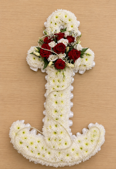 Anchor - A beautiful anchor-shaped funeral tribute symbolising strength, hope, guidance, and everlasting peace. Thoughtfully handcrafted in a classic white design with elegant red accents, this meaningful arrangement honours a loved one whose memory remains a steady presence in the hearts of family and friends.

The anchor is a powerful symbol of security, faith, and enduring love, making it a fitting tribute for someone who provided comfort, support, and stability throughout their life. Suitable for funeral services, memorial ceremonies, or celebrations of life, this arrangement offers a heartfelt expression of remembrance and respect.