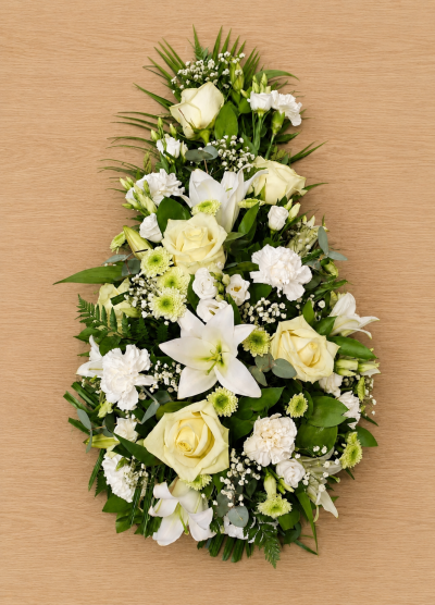 Teardrop Tribute - A graceful teardrop-shaped funeral tribute designed to express love, remembrance, and heartfelt sympathy. Featuring a serene palette of soft white and fresh green tones, this elegant arrangement creates a peaceful and comforting display, offering a meaningful farewell to a cherished loved one.

The teardrop shape symbolises eternal love and treasured memories, making it a thoughtful choice for funeral services, memorial ceremonies, or celebrations of life. Handcrafted with care, this tribute conveys respect, compassion, and lasting affection during a difficult time.
