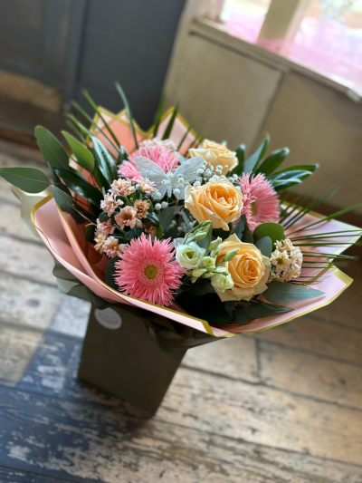 Peach Blush - A charming gift bouquet arranged in soft blush pink and peach tones, beautifully presented with lush foliage and a delicate butterfly detail. This elegant design combines gentle textures and warm pastel shades to create a thoughtful gift that radiates grace, happiness, and affection.

Perfect for birthdays, anniversaries, new baby celebrations, thank you gifts, or simply letting someone know they are loved, this stylish arrangement is handcrafted to bring joy and brighten any occasion.