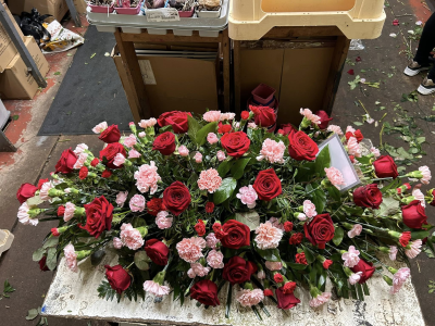 Casket Spray - A stunning funeral casket spray created in rich crimson and soft blush tones, symbolising deep love, treasured memories, and a lasting bond that will never fade. Designed with an abundance of elegant blooms and lush foliage, this heartfelt tribute offers a beautiful expression of devotion and remembrance.

Handcrafted with care, this graceful arrangement sits beautifully atop the casket, providing a meaningful farewell and honouring a loved one with warmth, dignity, and affection.