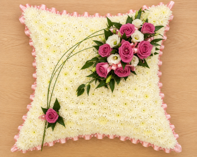 Cushion - Based cushion. This is based in white and the ribbon/top spray is available in most colours, please specify your preference in the special request section.