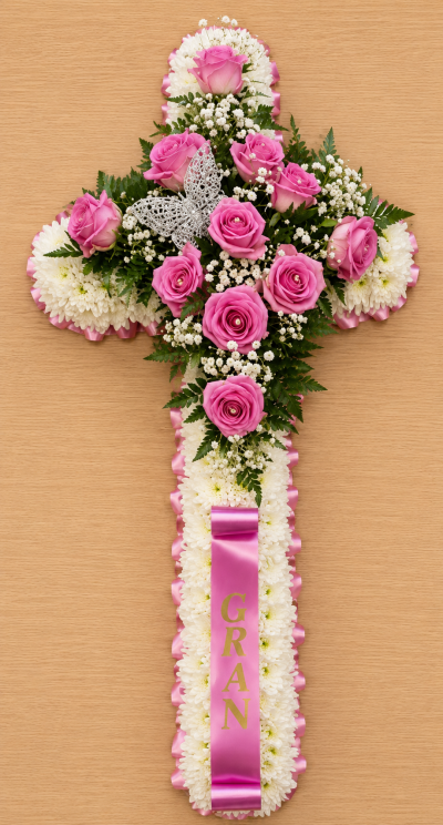 Cross Based - A beautiful and heartfelt wreath designed to honour a life well lived. This is made up of a white base, customer can specify colour of ribbon and top spray in the special request section.